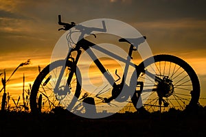 Bicycle silhouette on a sunset