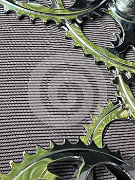 Bicycle sprockets. Bicycle stars on a fabric background. Bike parts