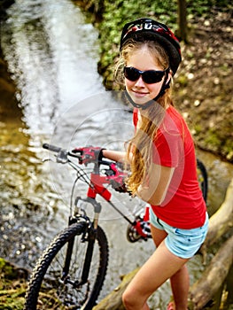 Bicycle teen with ladies bikes in summer park. Womens road bike for running