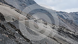 Bicycle tourist on the mountain road