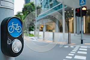 Bicycle traffic light button for road crossing