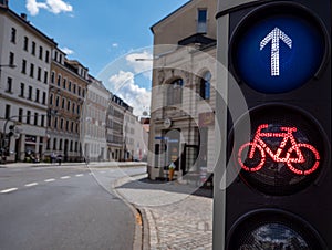 Bicycle traffic light stands on red in the city