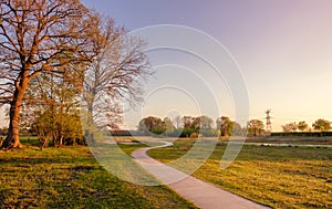 Bicycle trail in a Dutch landscape during sunset near Almelo