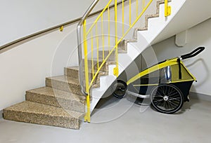 Bicycle trailer under the stairs