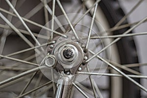 Bicycle wheel on the background of wheel spokes