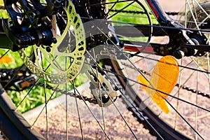 Bicycle wheel: disc brakes, spokes. Cycling, Bicycle repair, adjustment of brakes