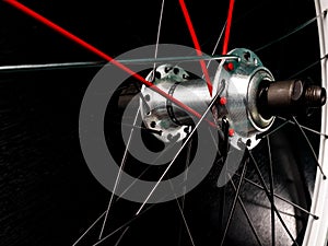 bicycle wheel with red and black spokes