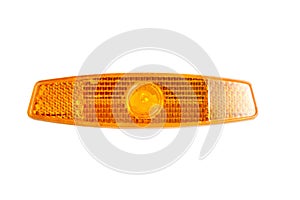 Bicycle wheel reflector isolated on white . Orange plastic reflector which is mounted on a bike spoke for safety at