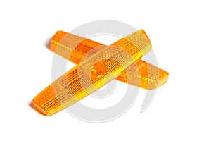 Bicycle wheel reflectors isolated on white. Two orange plastic reflectors for a bike spoke for safety at night