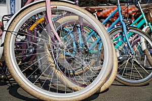 Bicycle wheel in a row close-up wheel detail, bicycle spoke.