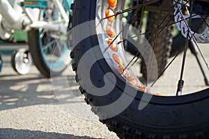 Bicycle wheel in a row close-up wheel detail, bicycle spoke.