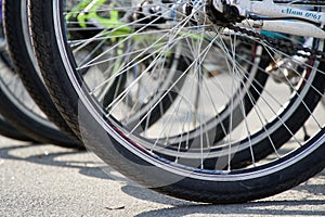 Bicycle wheel in a row close-up wheel detail, bicycle spoke.