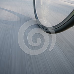 Bicycle wheel on street in motion