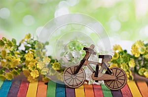 Bicycle wood model place on the colorful wooden