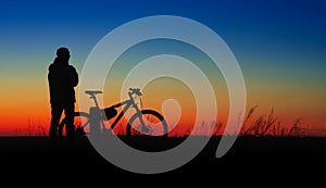 Bicycler silhouette on sunset