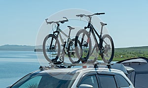 Bicycles are attached to the trunk of the car. concept of active recreation.