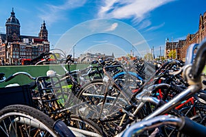 Bicycles on the background of the Basilica of Saint Nicholas Amsterdam, The Netherlands