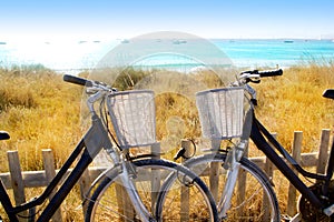 Bicycles couple parked in Formentera beach