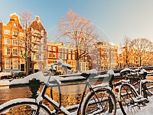 Bicycles covered with snow during winter in Amsterdam