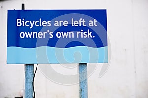 Bicycles left at owners own risk sign