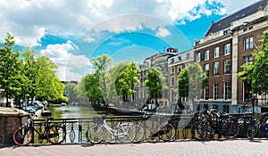 Bicycles lining a bridge over the canals of Amsterdam