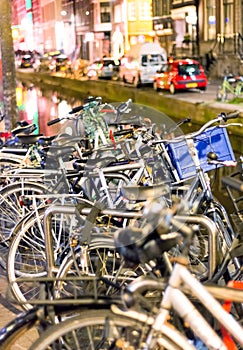 Bicycles lining a bridge over the canals of Amsterdam, Netherlan