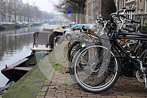 Bicycles lining a bridge over the canals of Amsterdam, Netherlands