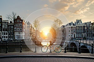 Bicycles lining a bridge over the canals of Amsterdam, Netherlands. Bicycle is major form of transportation in
