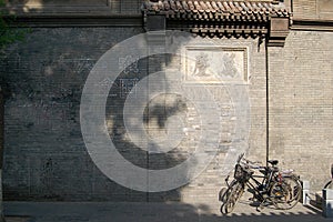 Bicycles beside old wall