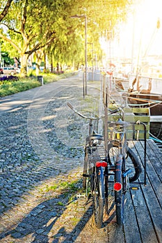 Bicycles parked at the bridges in the foreground