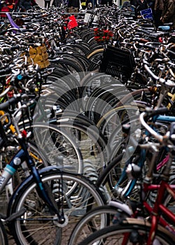 Bicycles parked in busy street of Amsterdam