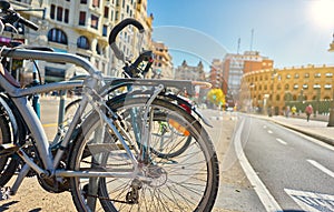 Bicycles parked on a city street. Cycling or commuting in the urban environment, ecological transport concept