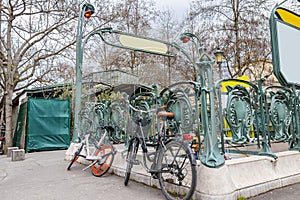 Bicycles parked in front of  Parisian metro station