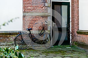 Bicycles parked in a street of city Gouda