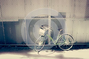 Bicycles parked by the wall - vintage and soft style