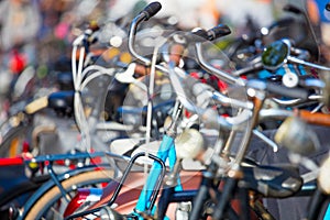 Bicycles parking. Artistic background. Selective focus on the foreground and beautiful bokeh background