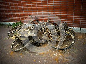 Bicycles pulled out of canal in Amsterdam. Old and rusty bikes piled up in street