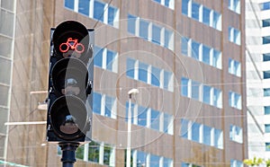 Bicycles red traffic light on building facade background