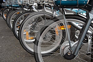 Bicycles for rent parked outdoor. Share transport, eco friendly city