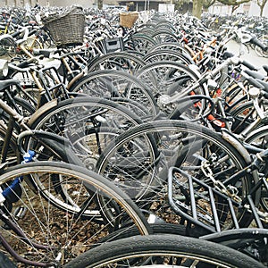 Bicycles stalled at a train station.