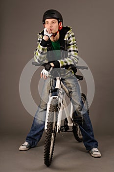 Bicyclist on gray photo
