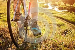 Bicyclist riding down the field to the river