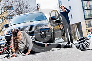 Bicyclist with serious injuries after traffic accident with a car photo