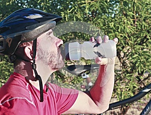 A Bicyclist Stops for a Water Break