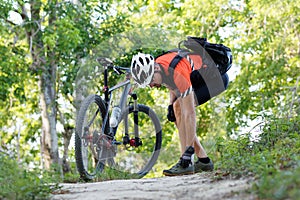 Bicyclist tightens the clasp of a Bicycle Shoe