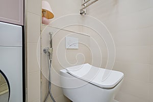Bidet in modern toilet with  wall mount shower attachment