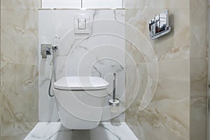 Bidet in modern toilet with  wall mount shower attachment