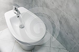Bidet with running water top down, with copy space