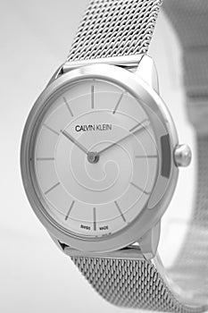 Biel, Switzerland 31.03.2020 - The closeup of CALVIN KLEIN man white clock face dial stainless steel bracelet swiss