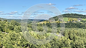 Bieszczady mountains in the vicinity of Lake Solinskie covered with forests and meadows sky blue clouds